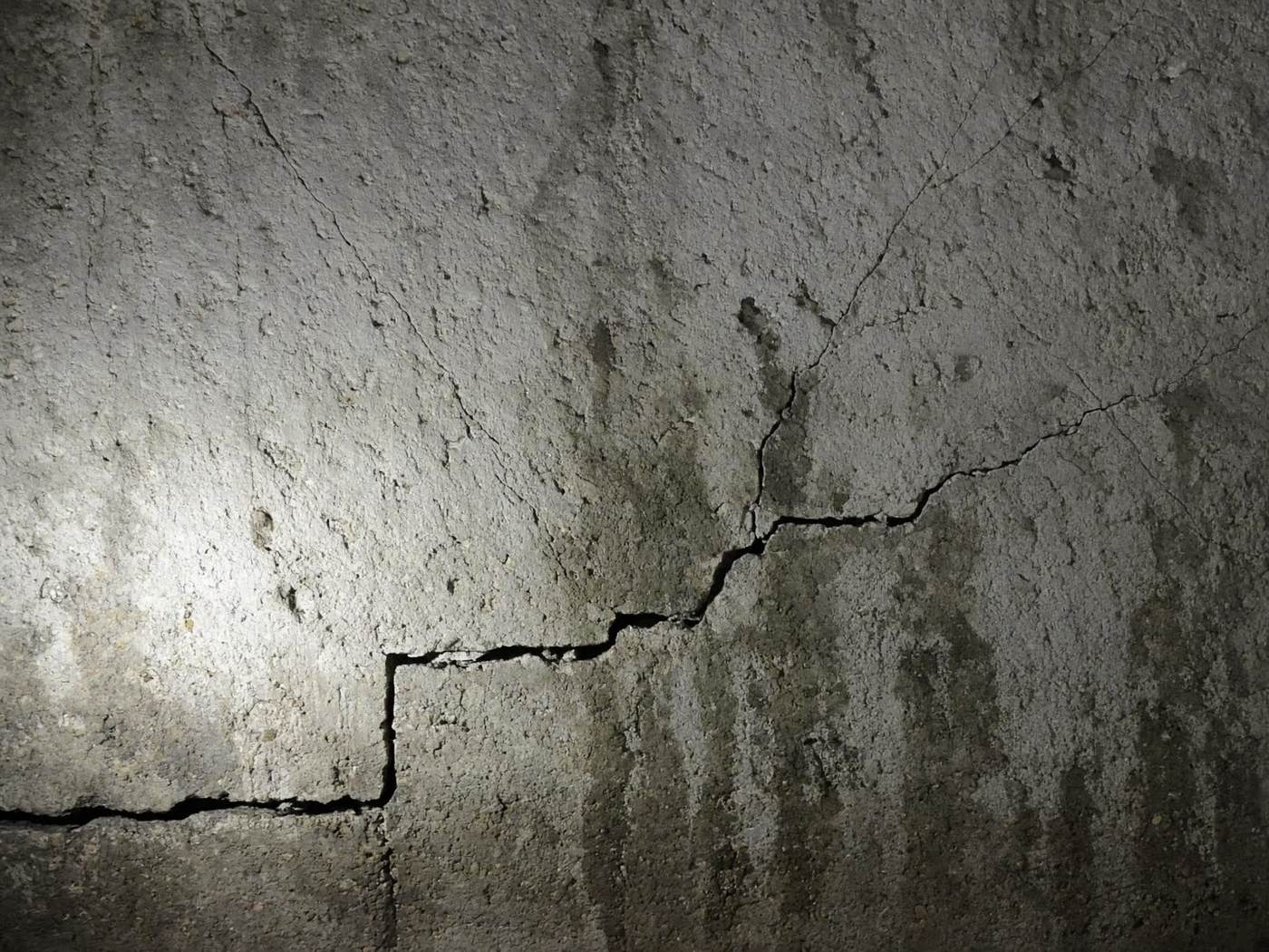 Cracked poured concrete foundation wall